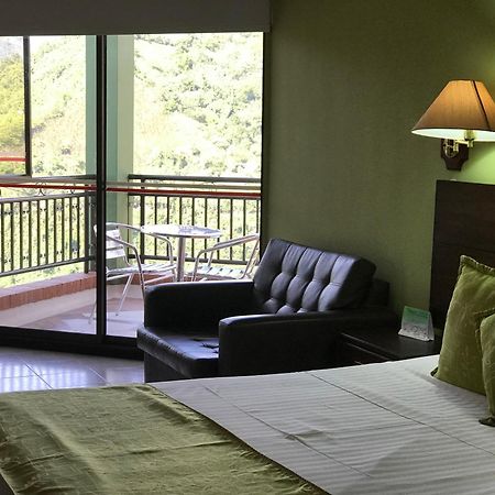 Casa Morales Hotel Internacional Y Centro De Convenciones Ibagué Exterior foto A room at the hotel